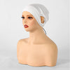 A mannequin head displays a white adjustable modal hijab cap with elastic bands.