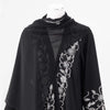 Black sheer abaya with gold floral beaded embroidery displayed on a white mannequin.