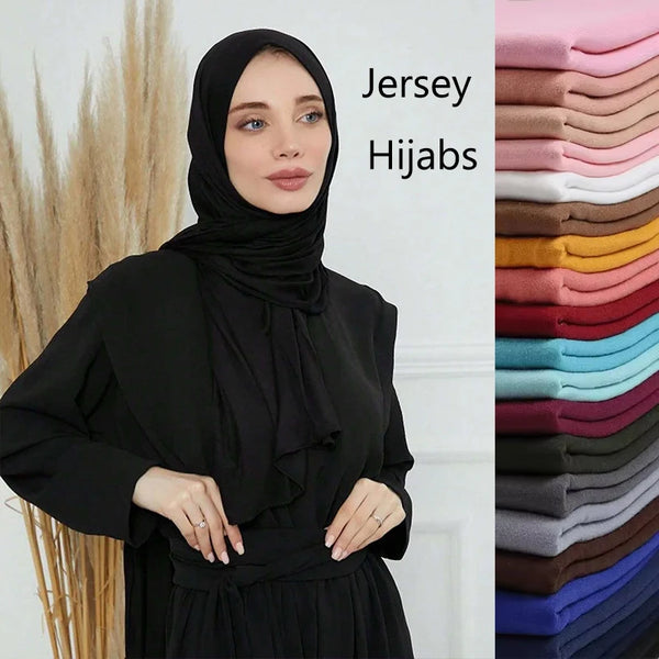 A woman wearing a black jersey hijab is shown next to a stack of 28-color modal cotton jersey hijabs.