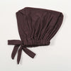 A dark brown adjustable cotton jersey inner hijab cap tied with a fabric bow.