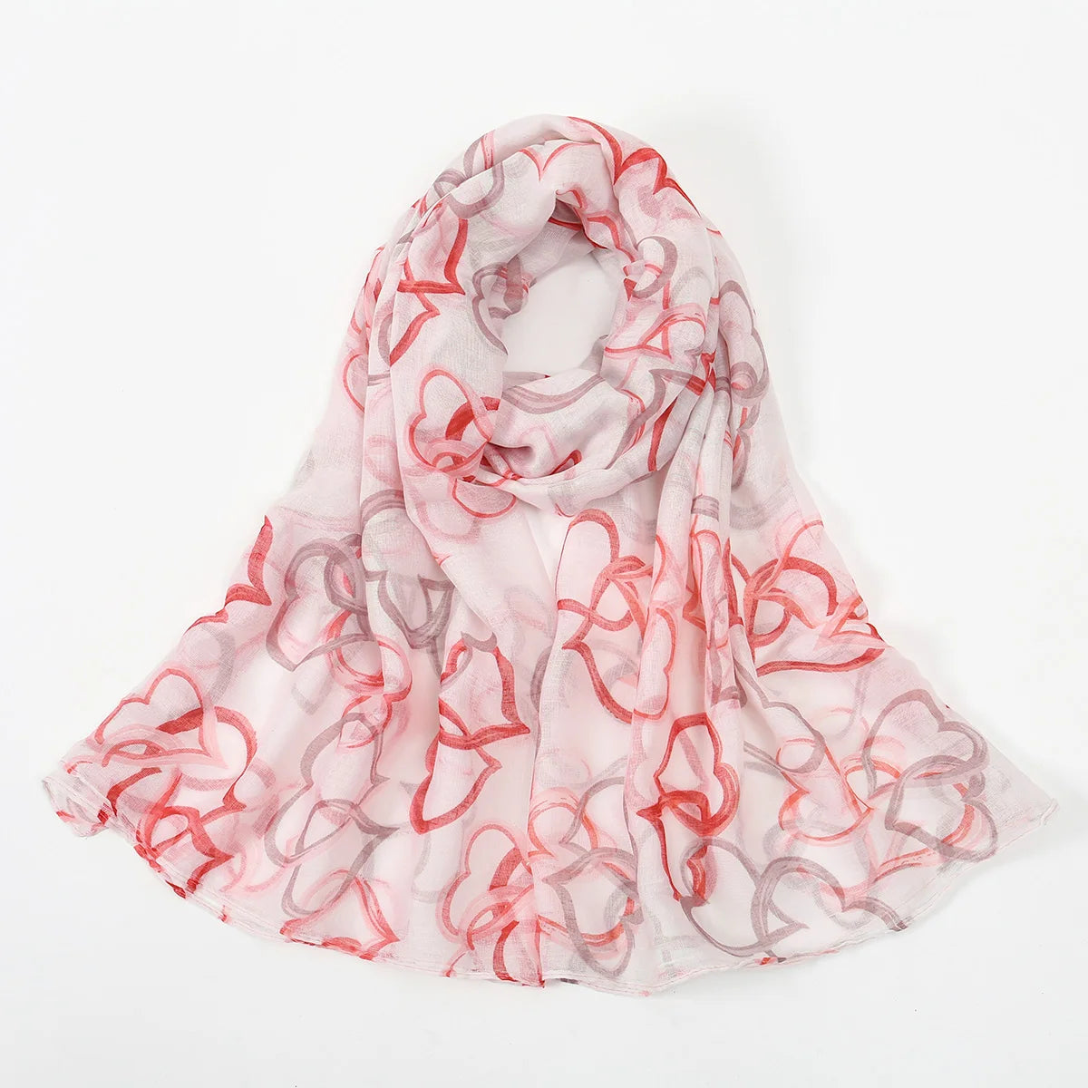 Durchscheinender rosa und roter Blumen-Viskose-Hijabschal, sanft drapiert.