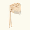 Beige Jersey-Turban-Kappe aus Baumwolle mit geraffter Draperie und transparentem Netzdetail.