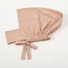A beige cotton polyester inner hijab cap scarf tied at the bottom.
