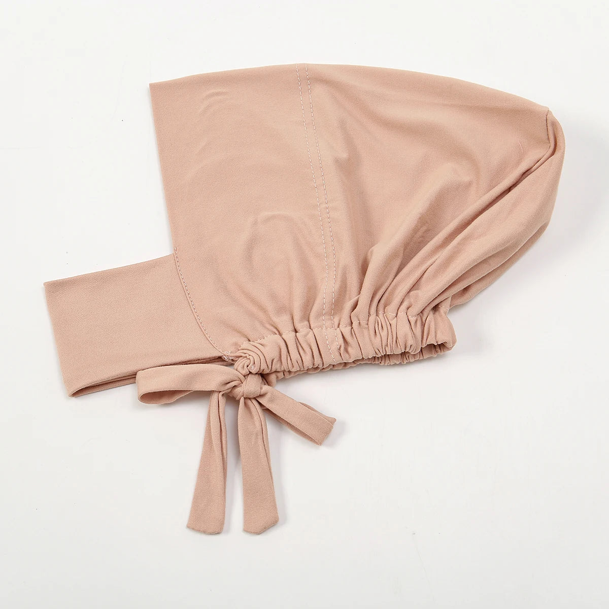 A beige cotton polyester inner hijab cap scarf tied at the bottom.