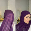 A woman wearing a purple chiffon instant hijab with a modal cotton cap, shown in a close-up profile view.