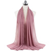 A soft dusty rose chiffon hijab scarf draped around a mannequin's neck.