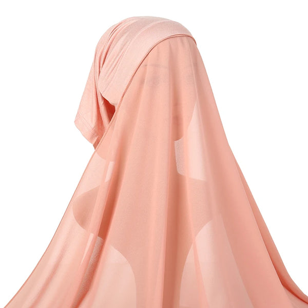 A light peach chiffon instant hijab draped over a model's head.