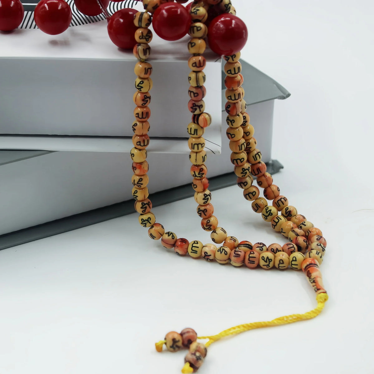 A string of 99 bead Islamic prayer tasbih for meditation and prayer, featuring wooden beads.