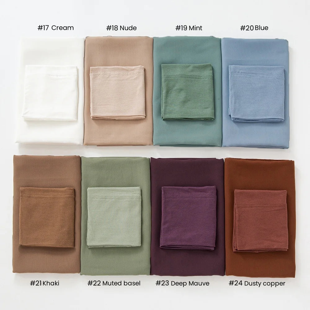 A collection of twenty-four colored chiffon hijab and undercap sets displayed in a grid.