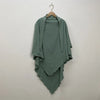 A teal two-layer everyday hijab scarf draped on a wooden hanger against a white wall.