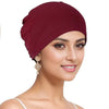 A model wearing a deep burgundy breathable cotton underscarf with an elastic fit.