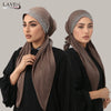 Model wearing a brown fashion diamond cotton elastic headband cap and black clothing.