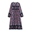 A bohemian floral maxi dress featuring pink, blue, and green floral patterns with lantern sleeves.