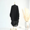Black ruffled 2-layer chiffon hijab displayed on a gold stand against a white background.