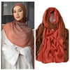 Model wearing a terracotta-colored Ramanda bamboo modal rayon scarf hijab