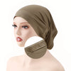 A close-up of a woman's head wearing an olive green adjustable elastic headband hijab cap.