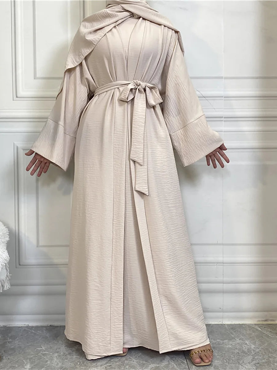 A beige elegant women's abaya and kaftan set displayed on a mannequin.