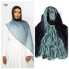 Model wearing a mint green Ramanda Bamboo Modal Rayon scarf hijab with a white dress.
