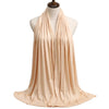 A beige premium modal jersey hijab draped around a mannequin's neck.