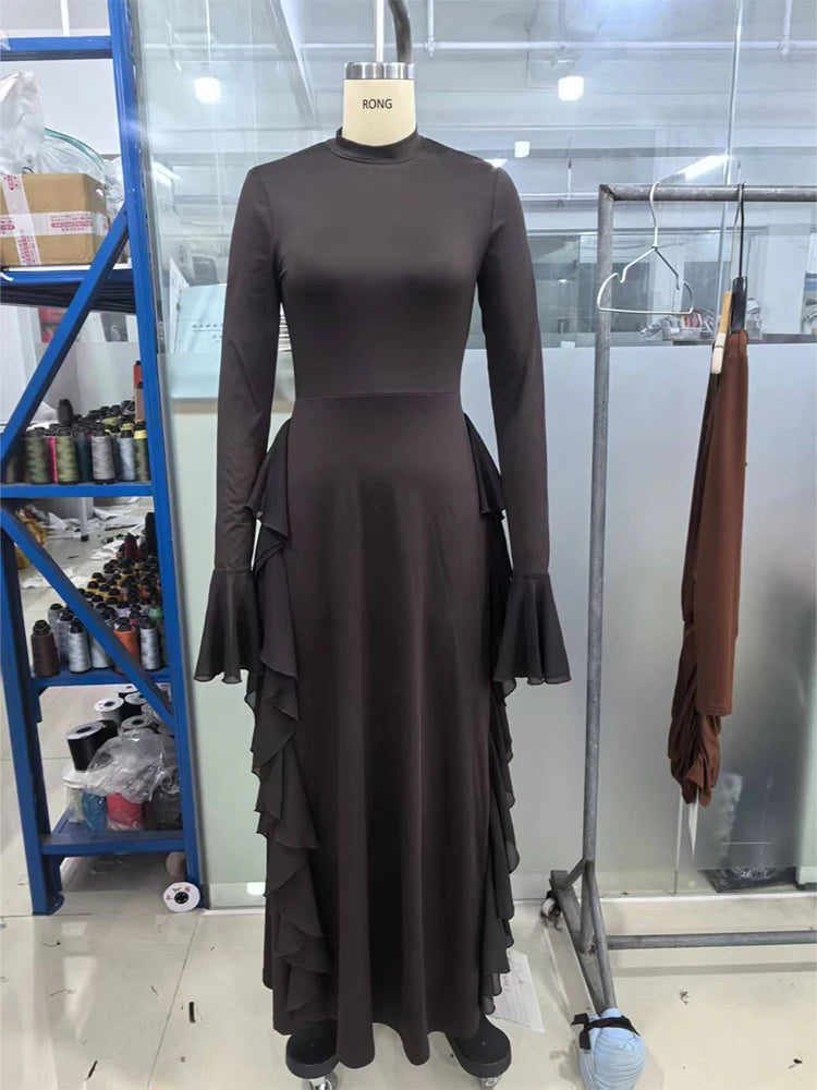 A dark brown elegant high-waisted long-sleeve A-line maxi dress displayed on a mannequin.