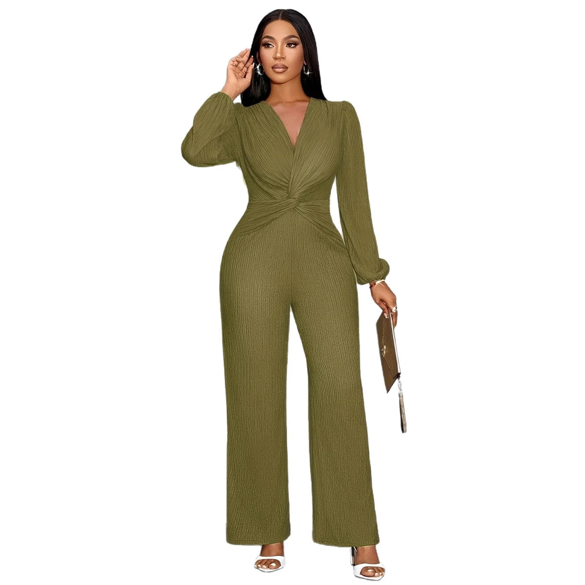 A woman models an olive green ribbed knit jumpsuit with a deep V-neck and puff sleeves.