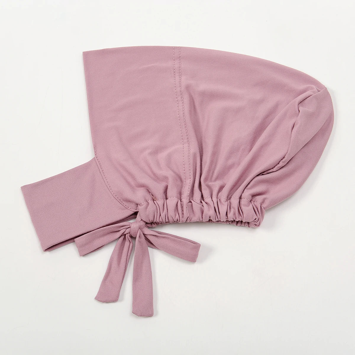 A soft mauve inner hijab cap scarf made of cotton polyester with a gathered knot detail.