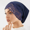 Model wearing a navy blue lace knit inner hijab undercap turban bonnet