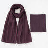 A deep plum colored chiffon hijab and underscarf set displayed flat.