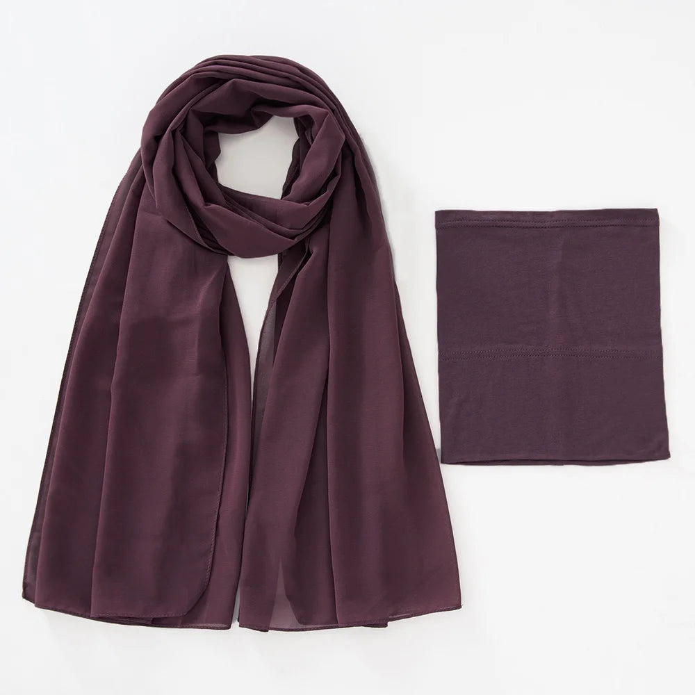 A deep plum colored chiffon hijab and underscarf set displayed flat.