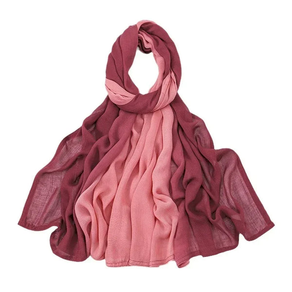 A draped gradient pink and maroon rayon modal hijab scarf folded on a white background.