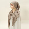 Model wearing a beige satin silk instant hijab scarf draped around her neck and head.