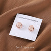 Set of 2 pink no-snag hijab magnets displayed on a white card against a brown fabric background