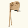 A beige adjustable elastic headband hijab cap for women shown from the side.