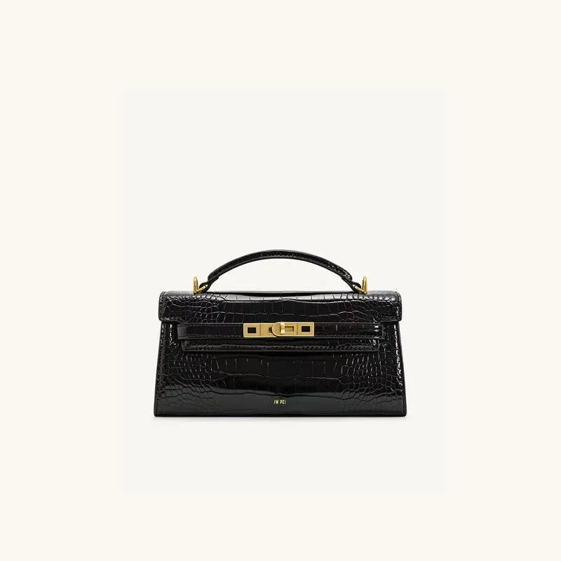 A black crocodile pattern shoulder bag with gold hardware.