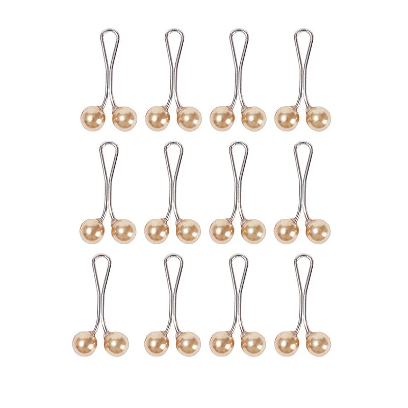 Ein Set von Perlen-Drop-Pins zum Befestigen von Hijab und Schals, in Reihen angeordnet.