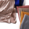 Colección de pañuelos de hijab de algodón premium y elástico doblados en tonos apagados como beige, rosa empolvado y verde ol