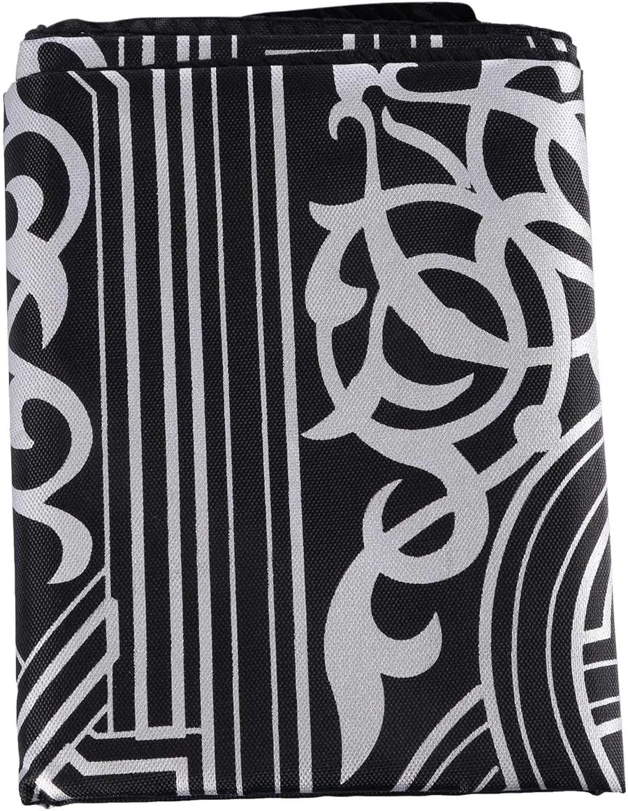 Black and white patterned portable braided prayer rug with compass design