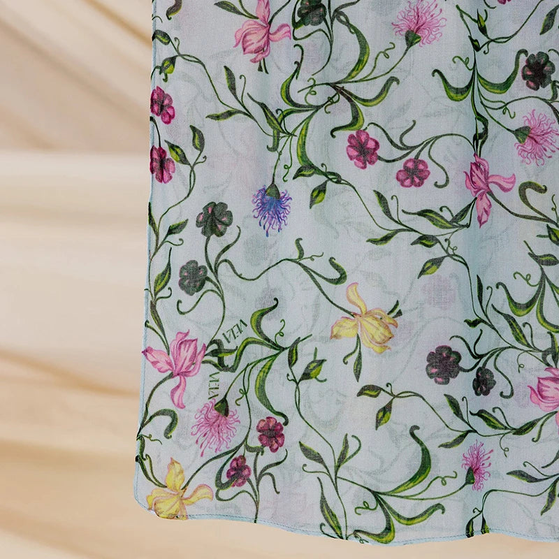 Light blue watercolor printed scarf hijab featuring green and pink floral vines