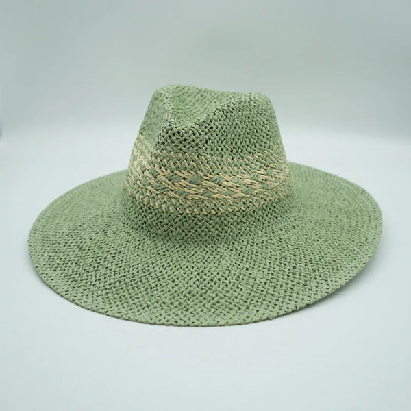A wide-brimmed summer Panama straw sun hat in a muted sage green color.