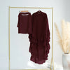 A maroon ruffled 2-layer chiffon hijab displayed on a gold hanger against a white background.