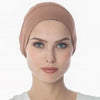 A model wearing a dusty rose breathable cotton underscarf with an elastic fit