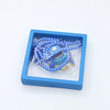 A blue box contains Islamic tasbih prayer beads and digital counter bracelets.