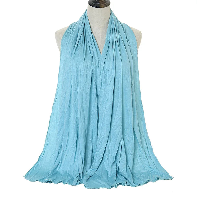 Light blue soft modal jersey hijab scarf draped around a mannequin's neck