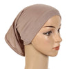 A beige chiffon instant hijab is shown draped on a mannequin head.