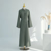 A full-length olive green modest dress displayed on a mannequin against a white background.