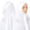 A woman wearing a white chiffon instant hijab with a modal cotton cap.
