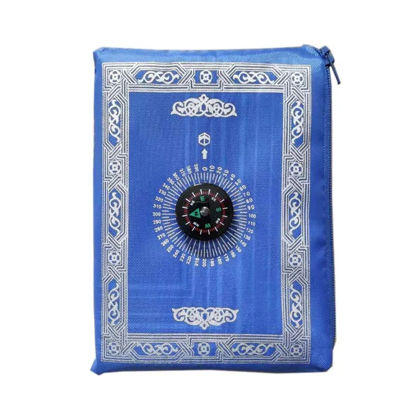 Blue portable braided prayer rug featuring an ornate border and a compass rose design.