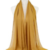 Fließender, durchgehender senffarbener Chiffon-Hijab-Schal über einem Mannequin