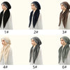 Sechs Variationen eines schwarz-beigen Stoffturban, getragen von einem Model.